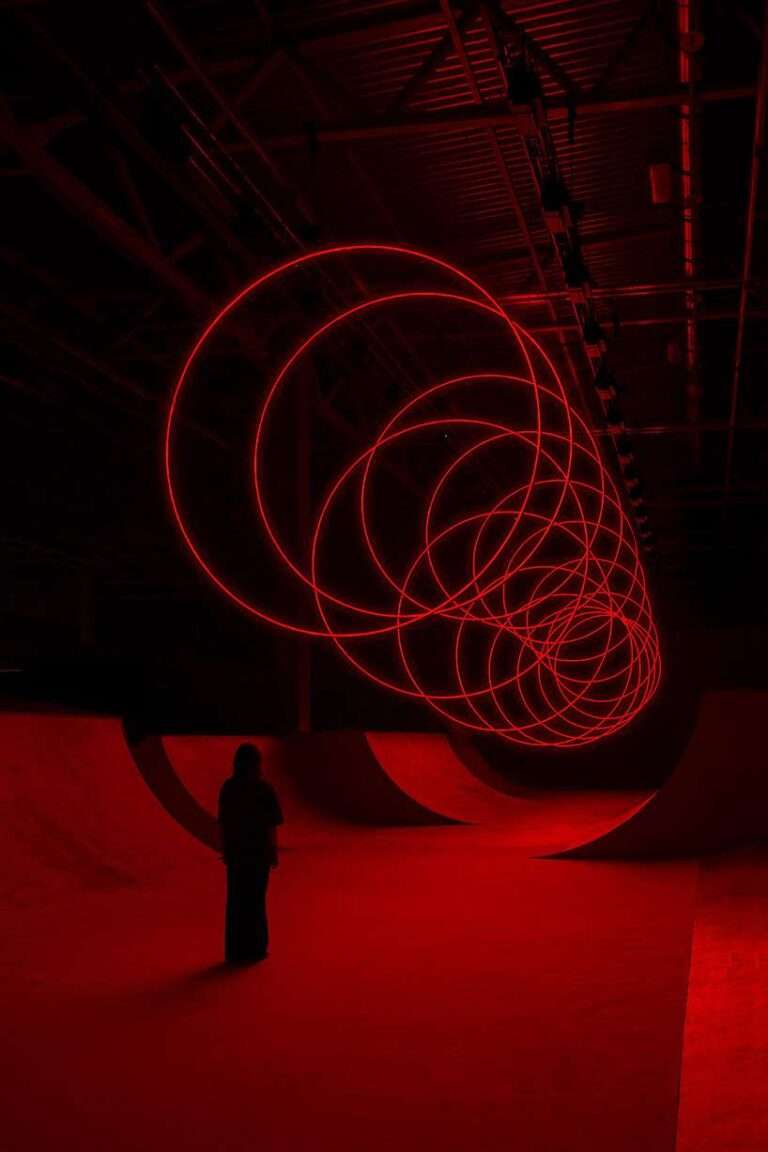 floating rings of light redraw space in SpY’s kinetic spatial installation