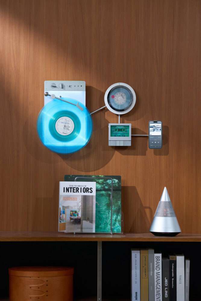 wall-mounted vinyl player connects with CD and cassette decks for triple listening session