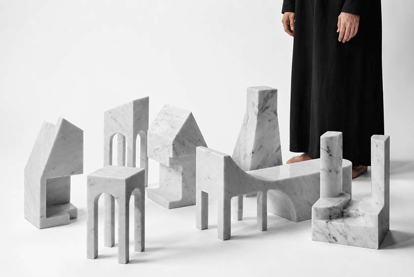 carved from solid carrara marble, abstract house-like objects explore architectural form - 1