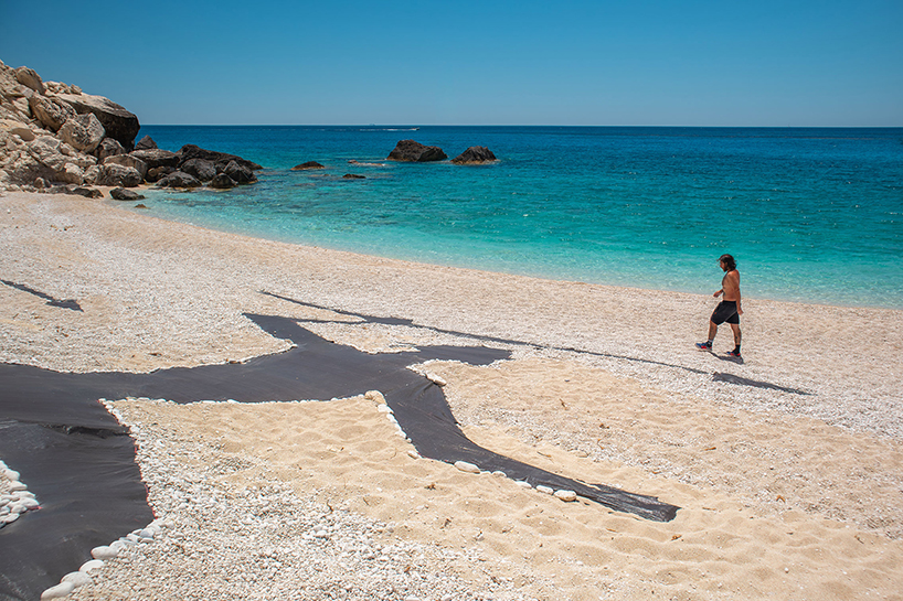 land art turns a greek beach into a scene of ancient hunters and modern extraction - 4