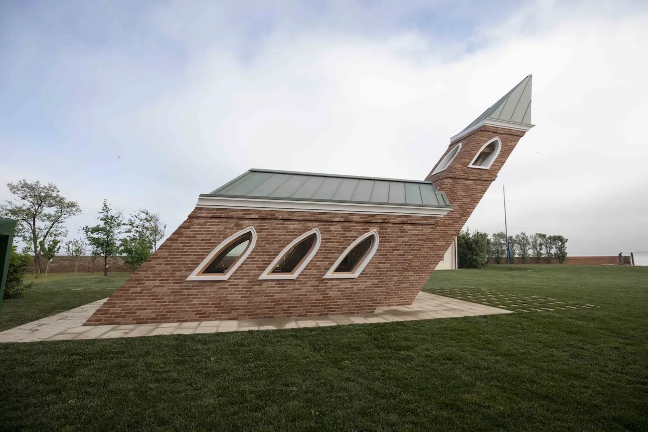 Brick chapel leaning 40 degrees forward, side view