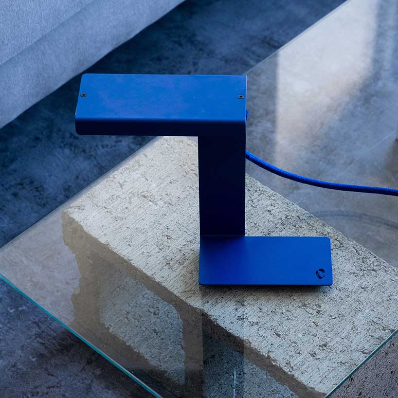 single sheet of folded steel sculpts into z-shaped table lamp - 2