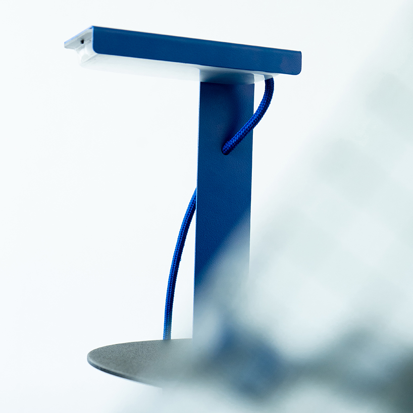 single sheet of folded steel sculpts into z-shaped table lamp - 3