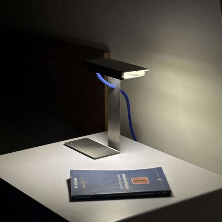 single sheet of folded steel sculpts into z-shaped table lamp