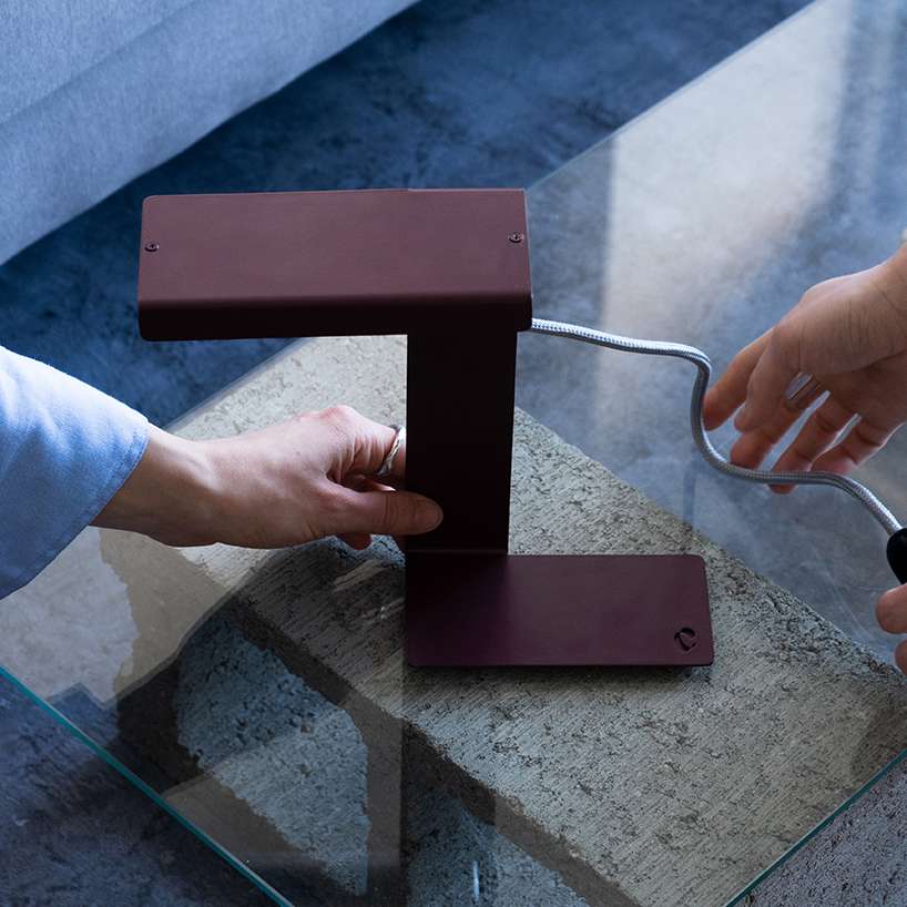 single sheet of folded steel sculpts into z-shaped table lamp - 1