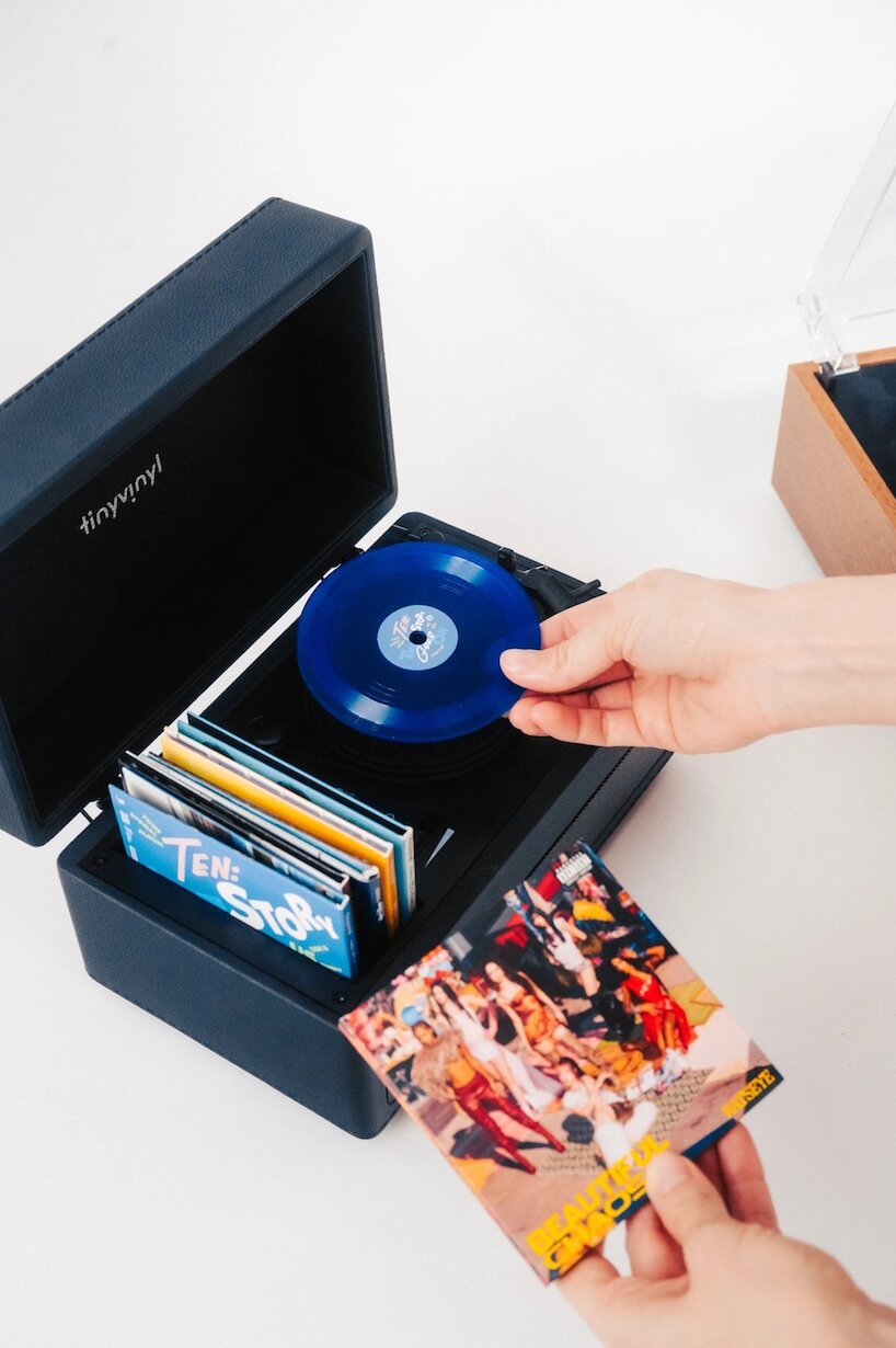 tiny vinyl player spins four-inch records on a miniature turntable - 3