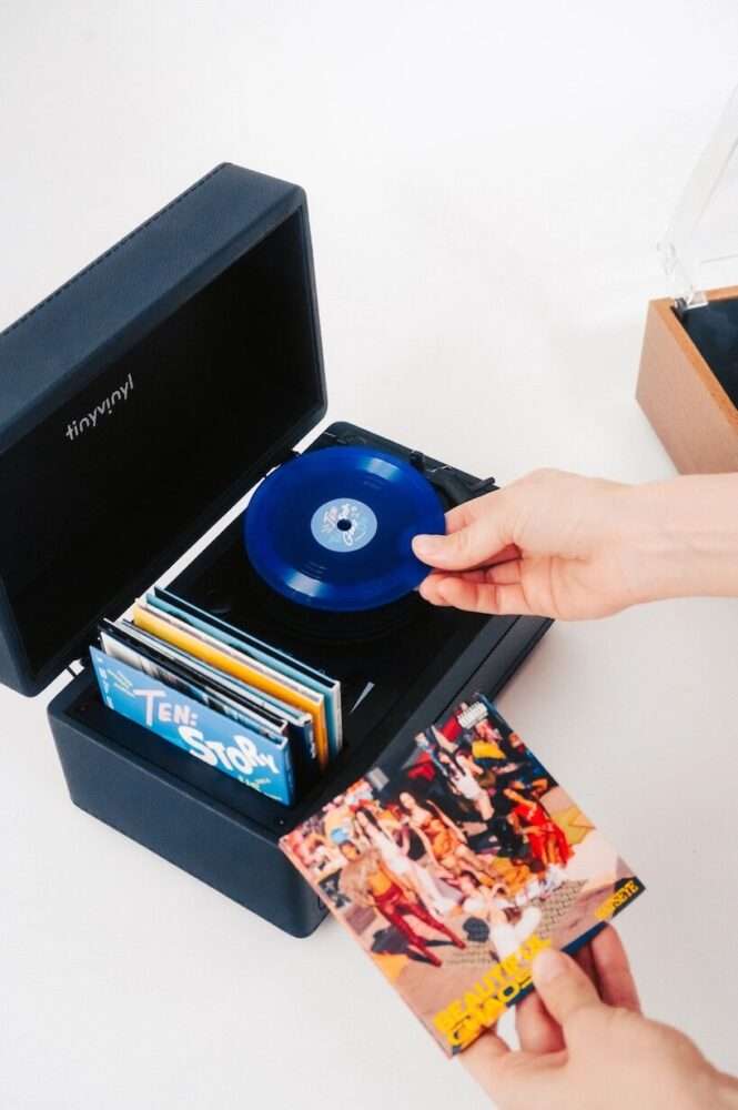 tiny vinyl player spins four-inch records on a miniature turntable