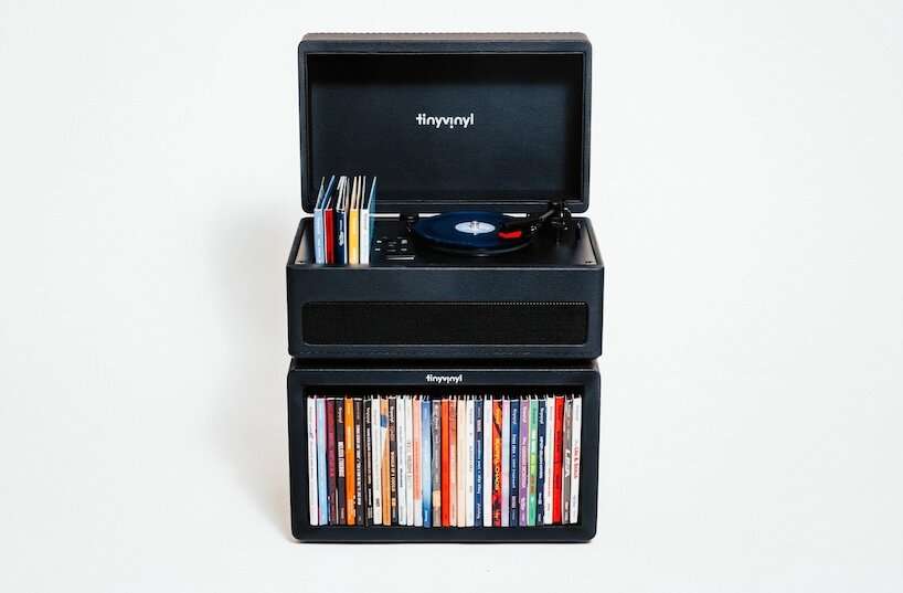 tiny vinyl player spins four-inch records on a miniature turntable - 1