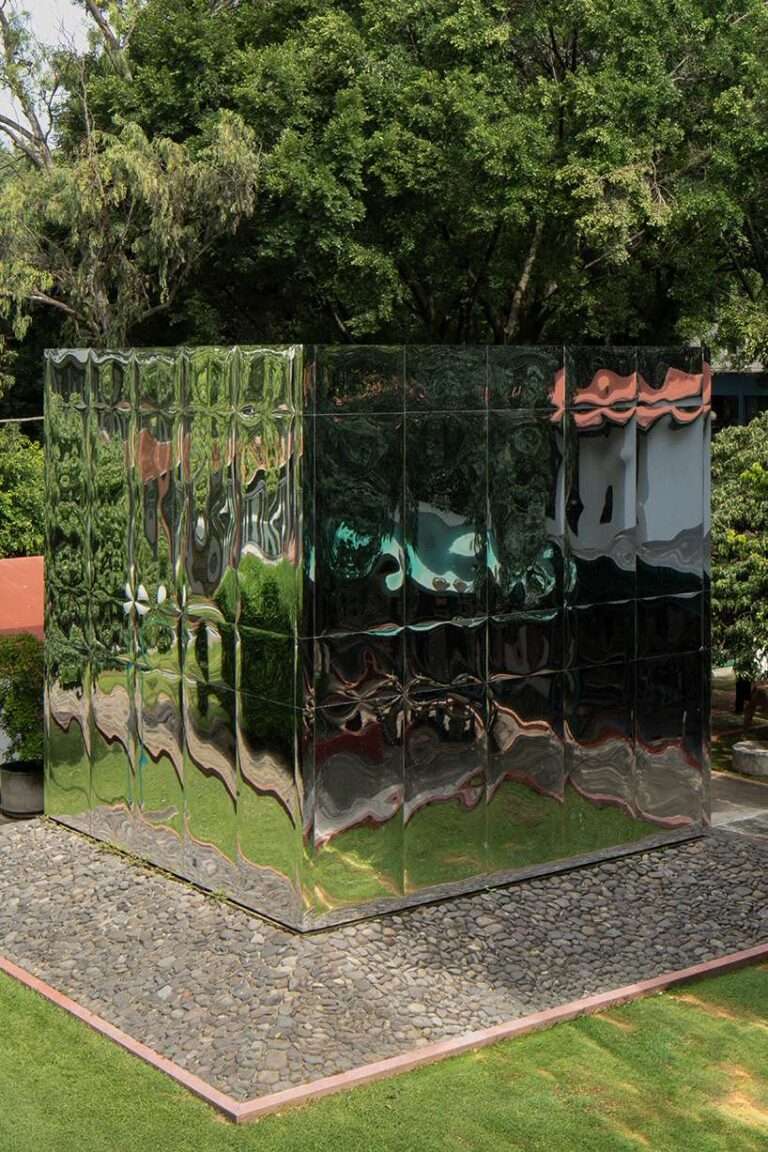 mirrored acrylic skin dissolves cube pavilion into its surroundings in mexico