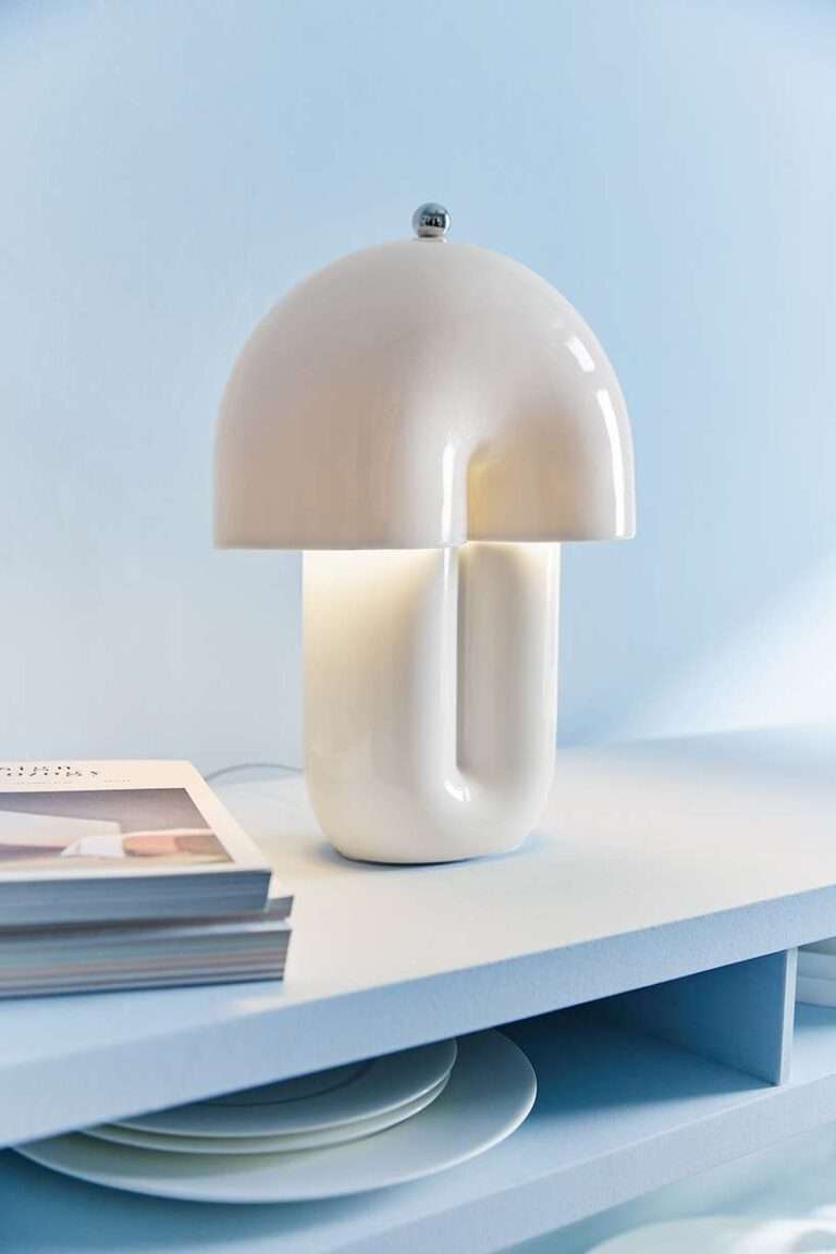 split ceramic curves cast soft reflected light in dimmable table lamp