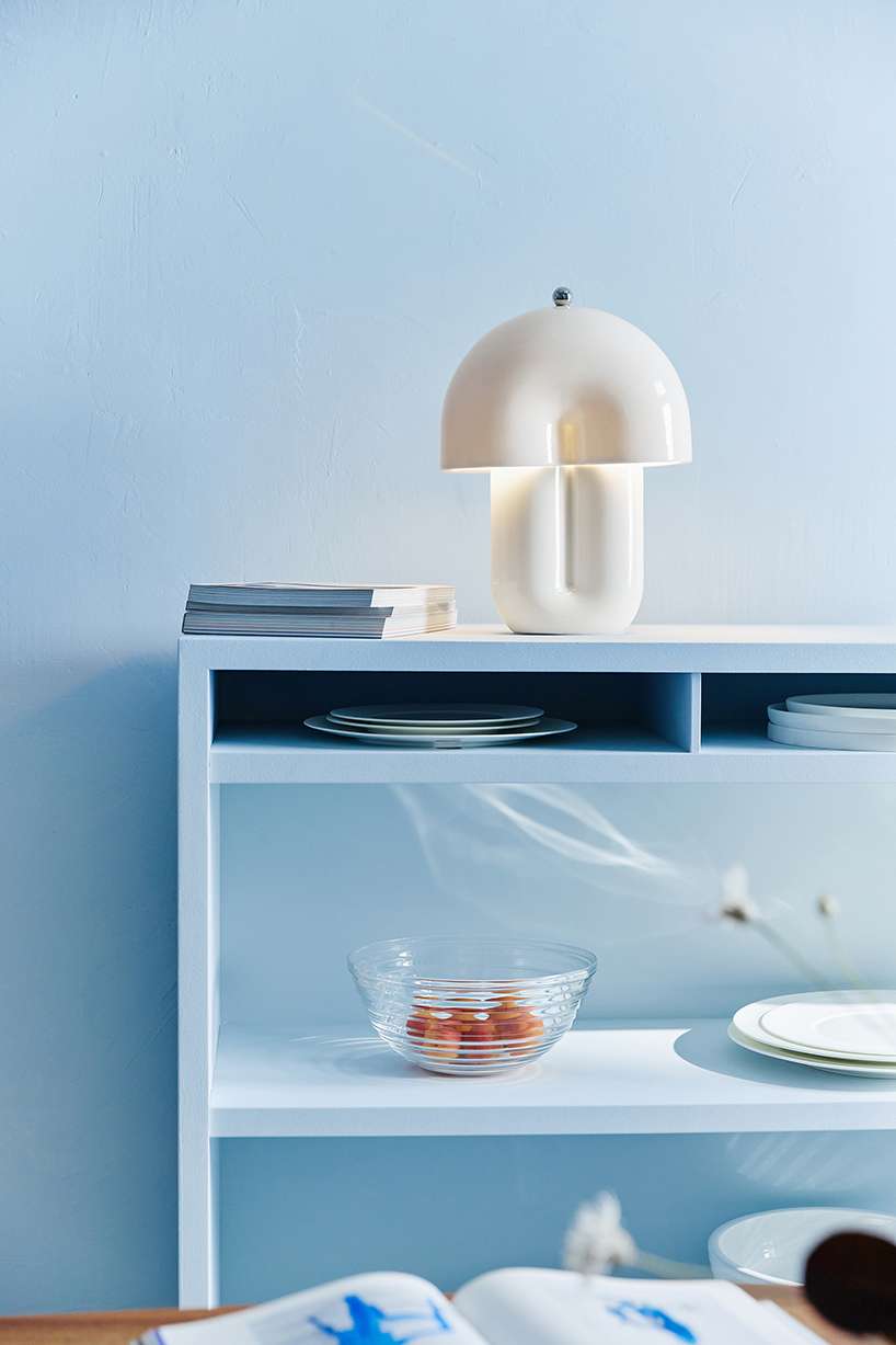 split ceramic curves cast soft reflected light in dimmable table lamp - 1